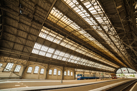 Old European train station with a platform. Arch metal train station.