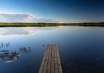 Fototapeta na wymiar Camp sites in goergeous lakeside settings in the Aukstaitija National Park, Lithuania. Lithuania's first national park.