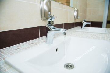 Fototapeta premium Close-up of row modern ceramic wash hand basins