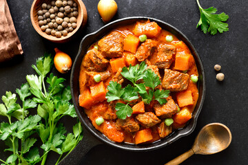 Beef stew with potatoes in tomato sauce