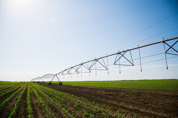 Modern agricultural irrigation system spraying in field