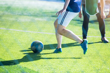 Selective focus to soccer player control and shoot ball to goal with goalkeeper. Soccer players...