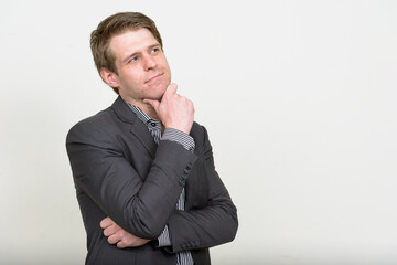 Portrait of young handsome businessman in suit
