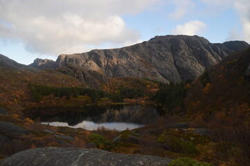 Colorful autumn refelctions and colors in the mountains on the beautiful fjords of Lofoten in Norway