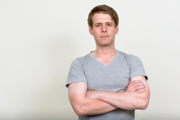 Portrait of young handsome man with blond hair