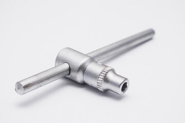 Wrenches close-up on a white background. Chrome plated wrenches. Wrenches of different sizes and types..