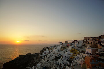 Fototapeta na wymiar Beautiful sunset view of Santorini island, Oia, Greece, Europe