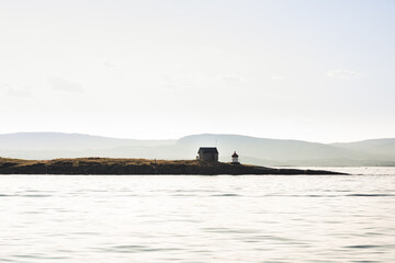 Fototapeta premium Small lighthouse at sunset