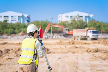 Asian construction engineer checking construction site for new Infrastructure project. photo concept for engineering work. - obrazy, fototapety, plakaty