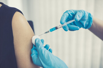 Doctor vaccinated against new strains of the virus for the patient to build immunity.