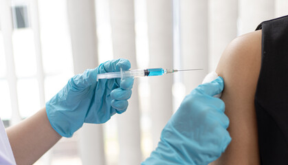 Doctor vaccinated against new strains of the virus for the patient to build immunity.