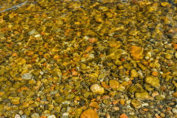 rock bottom seen through clear water in lake Paijanne, Finland