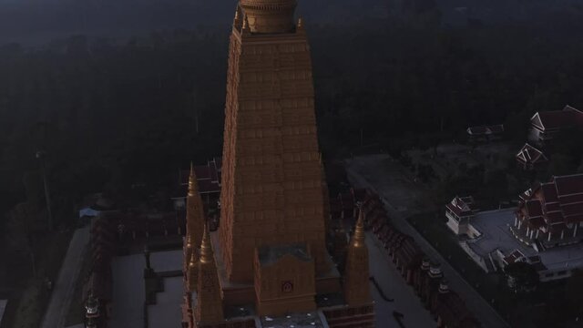 Drone aerial shot of sunrise over Wat Mahathat Watchiramongkhon (Wat Bang Thong) in Krabi, Thailand
