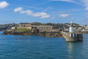Naklejka premium View from sea of Castle Cornet. Castle Cornet has guarded Saint Peter Port for 800 years. Saint Peter Port - capital of Guernsey, British Crown dependency in English Channel off coast of Normandy.