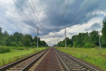 Fototapeta na wymiar railway in a rural landscape. Evening, summer time