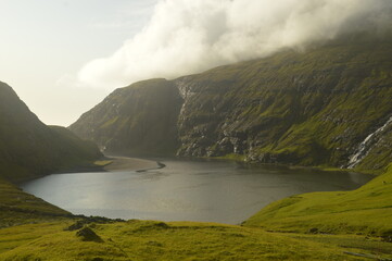 Naklejka premium The dramatic and mystical landscapes on the coast and mountains of the Faroe Islands