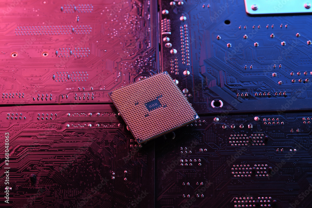 Poster computer cpu processor chip on circuit board ,motherboard background. close-up. with red-blue lighti