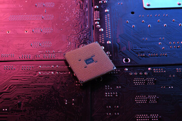 Computer cpu processor chip on circuit board ,motherboard background. Close-up. With red-blue...