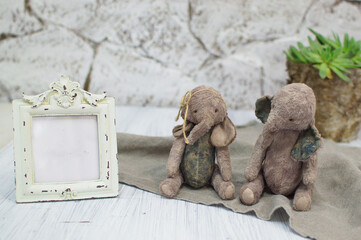 two toy elephants handmade in vintage style.For postcards, posters for christmas day, holiday.Selective focus.