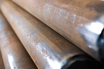 close up of a stack of steel rusty pipes