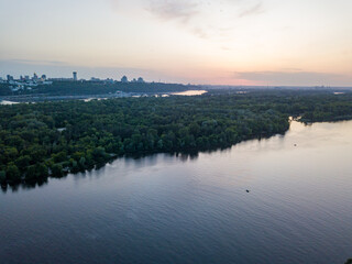 Fototapeta na wymiar Sunset over the Dnieper River in Kiev. Aerial drone view.