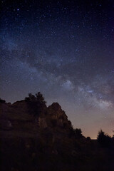Dark night with a sky full of stars and the beautiful Milky Way. Night landscape wonder of nature.