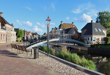 The quaint town of Kollum in Friesland in the Netherlands on a sunny summer's evening. View of the...
