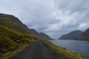 Fototapeta na wymiar The stunning and dramatic coast and mountains on the Faroe Islands