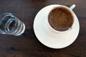 a cup of coffee in a cafe by the sea