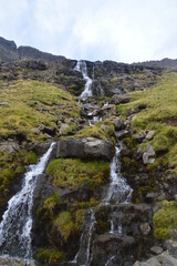 Fototapeta na wymiar The stunning and dramatic coast and mountains on the Faroe Islands
