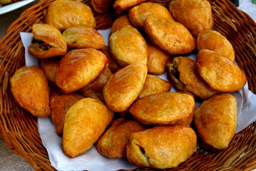 traditional home baked bacon and lard patty from a yeast dough. Home baked pies filled with smoked bacon. Traditional latvian kitchen recipe