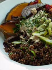 Wholefoods pumpkin and quinoa dish on wooden table