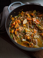 Rustic carrot and lentil curry in pot
