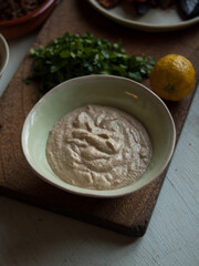 Tahini with roast vegetables on table