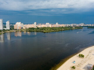 Fototapeta na wymiar Aerial view of the Dnieper River and the city of Kiev from above. Summer sunny day.