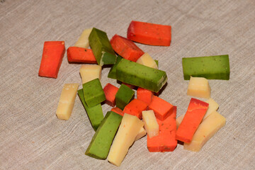 colored cheese and a cutting board