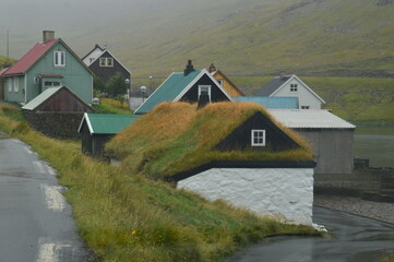 Fototapeta na wymiar The dramatic coast and mountain landscape on the Faroe Islands