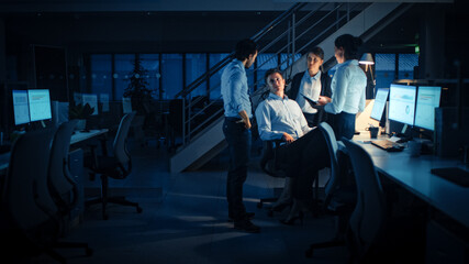 Late at Night In Modern Office: Diverse Team of Successful and Ambitious Businessmen and...