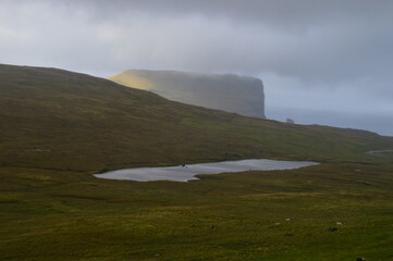 The dramatic coast and mountain landscape on the Faroe Islands