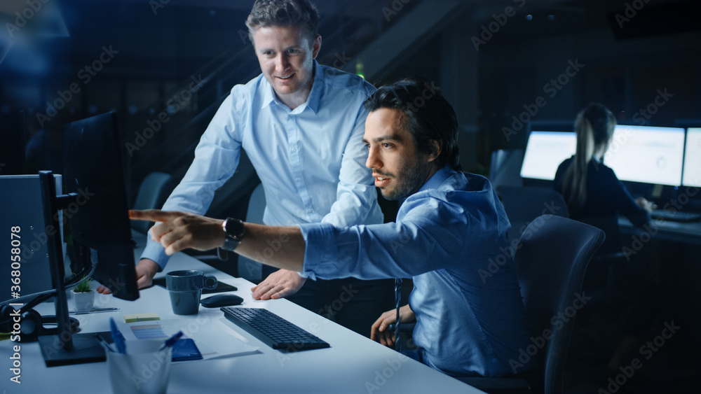 Aufkleber ambitious and confident businessman uses desktop computer, his project manager explains specific tas