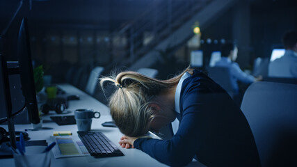 In the Office at Night Overworked Tired Female Office Worker Fell Asleep on Her Hands. She wes Using Desktop Computer. Tired Exhausted Businesswoman Finishing Important Project