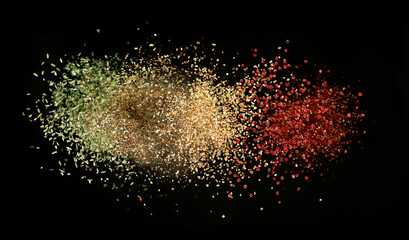 Freeze motion of spice explosion, black background