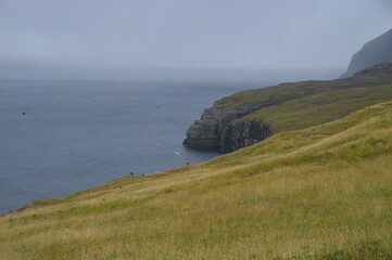 Fototapeta na wymiar The dramatic coast and mountain landscapes of the Faroe Islands