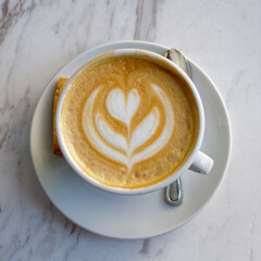 Italian cappuccino coffee cup on marble table surface