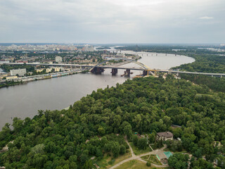 Fototapeta premium Construction of a bridge across the Dnieper river in Kiev. Aerial drone view.