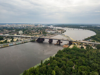 Fototapeta na wymiar Construction of a bridge across the Dnieper river in Kiev. Aerial drone view.