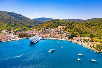 VIS, VIS ISLAND, CROATIA Aerial view of the city and port with passenger ferry which connects Split and Vis