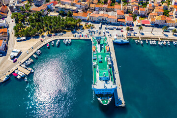 VIS, VIS ISLAND, CROATIA Aerial view of the city and port with passenger ferry which connects Split and Vis