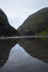 Fototapeta na wymiar The dramatic coast and mountain landscapes of the Faroe Islands
