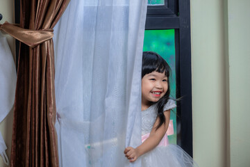 Portrait of cute asian little girl in princess dress,A girl pose for take a picture,Thailand people